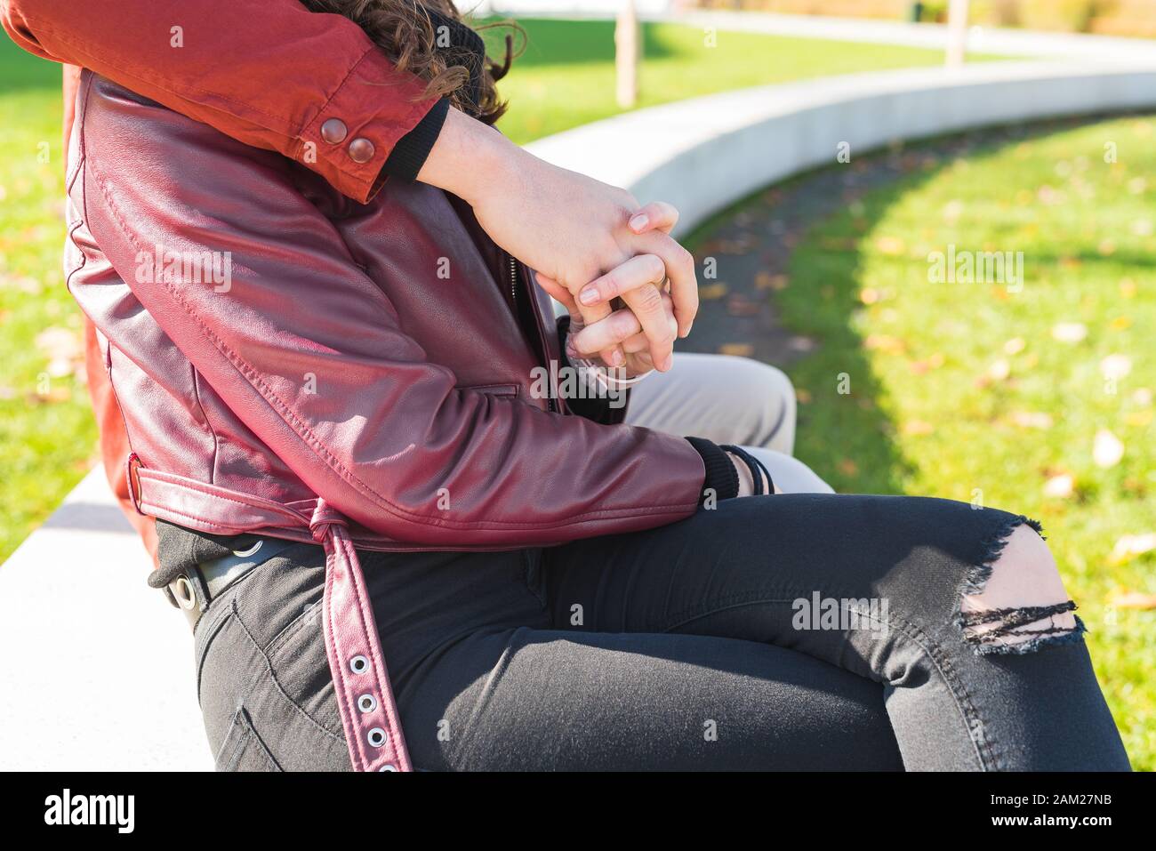 hands with intertwined fingers of two first lovers, Love Concept, millenials couple Stock Photo