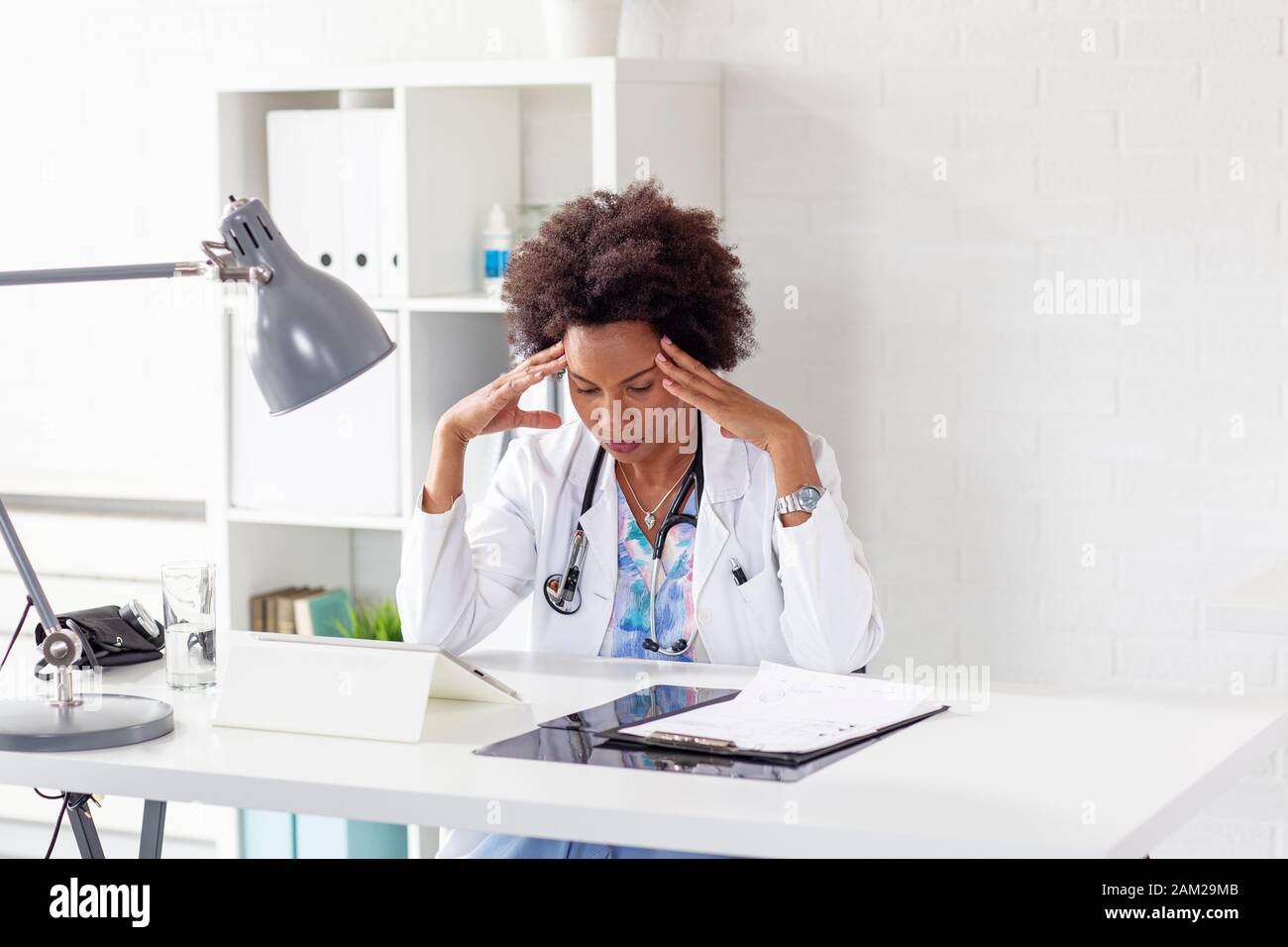 Black female doctor office sitting hi-res stock photography and images ...