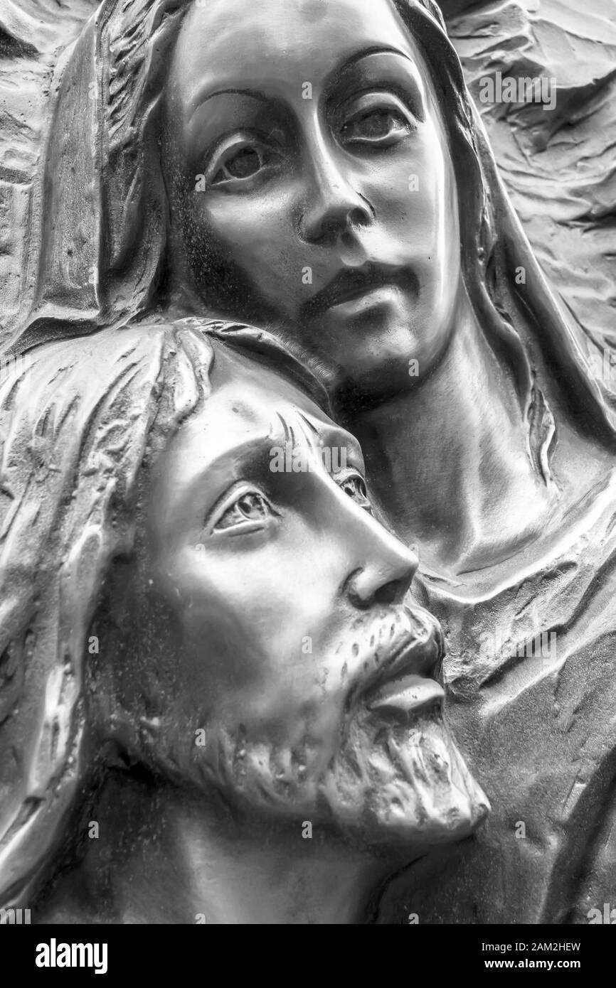 Mother Mary holding her son Jesus. Black and white portrait. Stock Photo