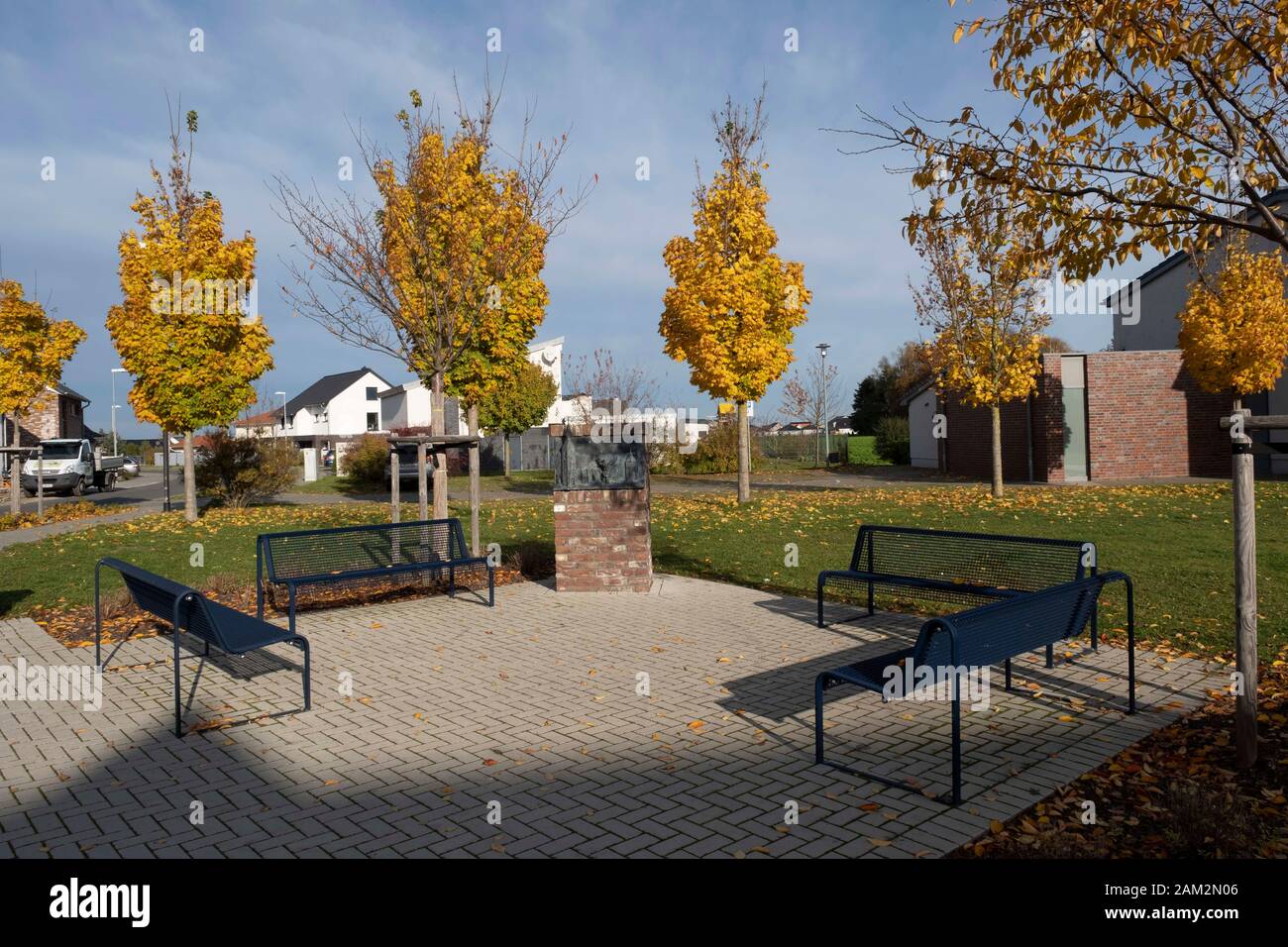 Park benches and green spaces in new town, Borschemich Neu, Germany Stock Photo