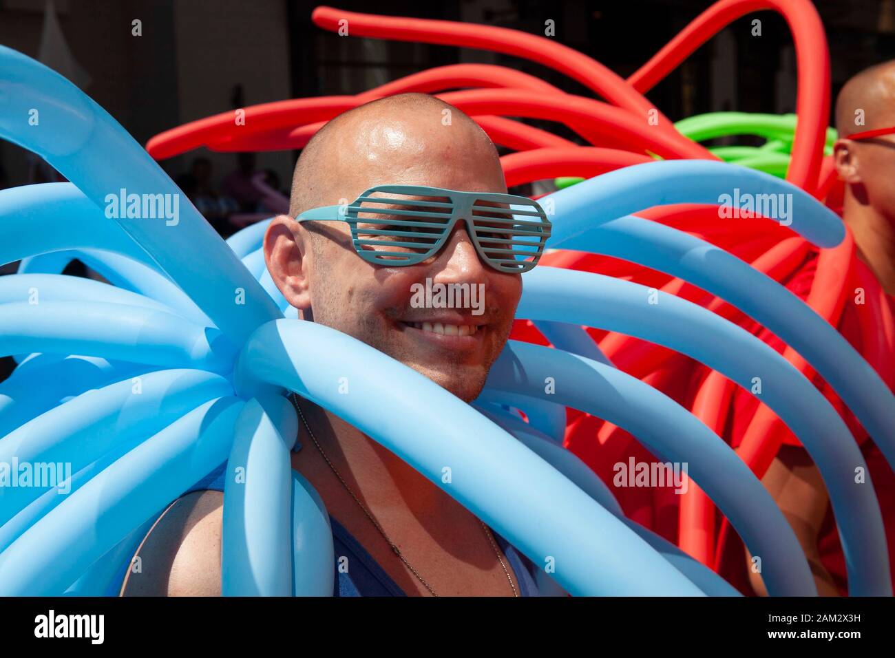 Pride parade participants in tentacle-like balloon costume, Vancouver Pride Festival 2014, Vancouver, Canada Stock Photo
