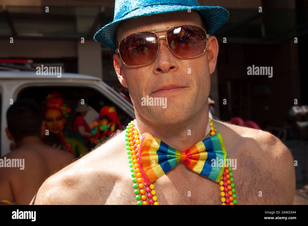 Pride parade participant in rainbow colour bow tie costume, Vancouver Pride Festival 2014, Vancouver, Canada Stock Photo