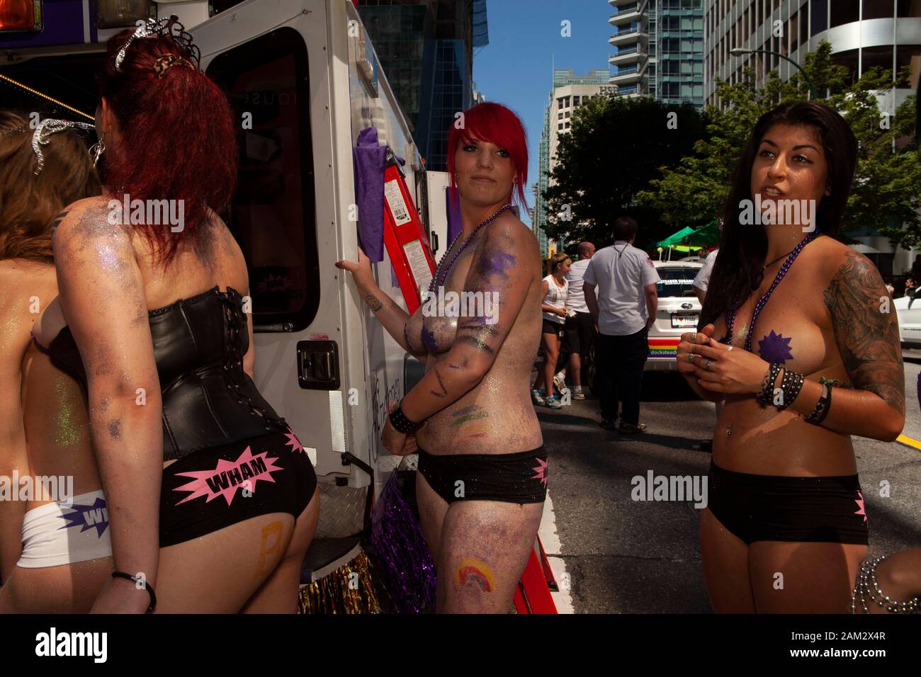 Topless pride parade participants in fancy and fetish costumes, Vancouver Pride Festival 2014, Vancouver, Canada Stock Photo