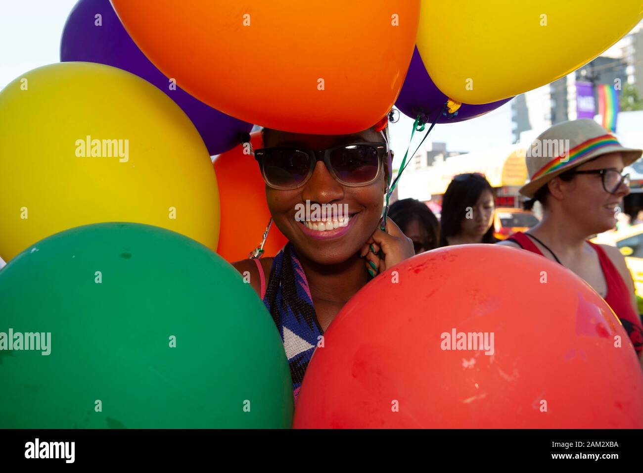 Pride parade participant hidden by her balloon costume, Vancouver Pride Festival 2014, Vancouver, Canada Stock Photo