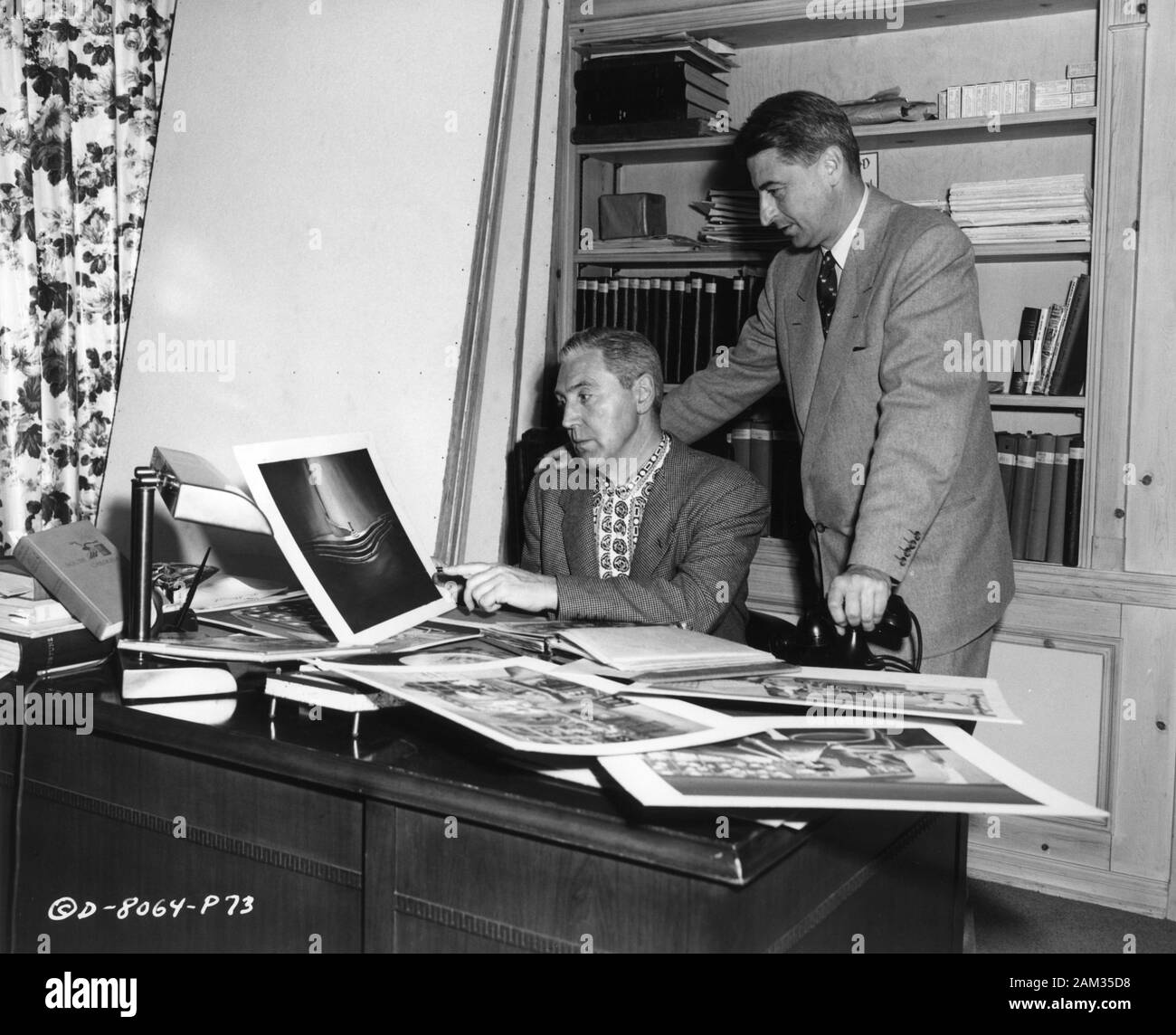 Production Designer RUDOLPH STERNAD and author TED GEISEL aka DR. SEUSS production candid during making of THE 5000 FINGERS OF DR. T. 1953 director Roy Rowland story and conception Dr. Seuss screenplay Dr. Seuss and Allan Scott photo by Edward Cronenweth Stanley Kramer Productions / Columbia Pictures Stock Photo