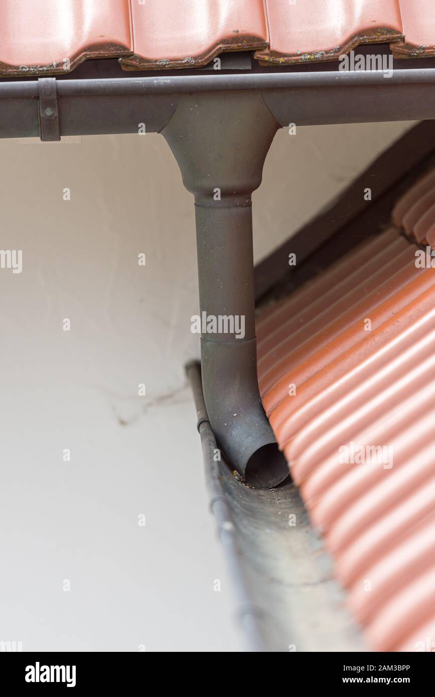 Gutter made of copper sheet. Gutter construction with downpipe Stock