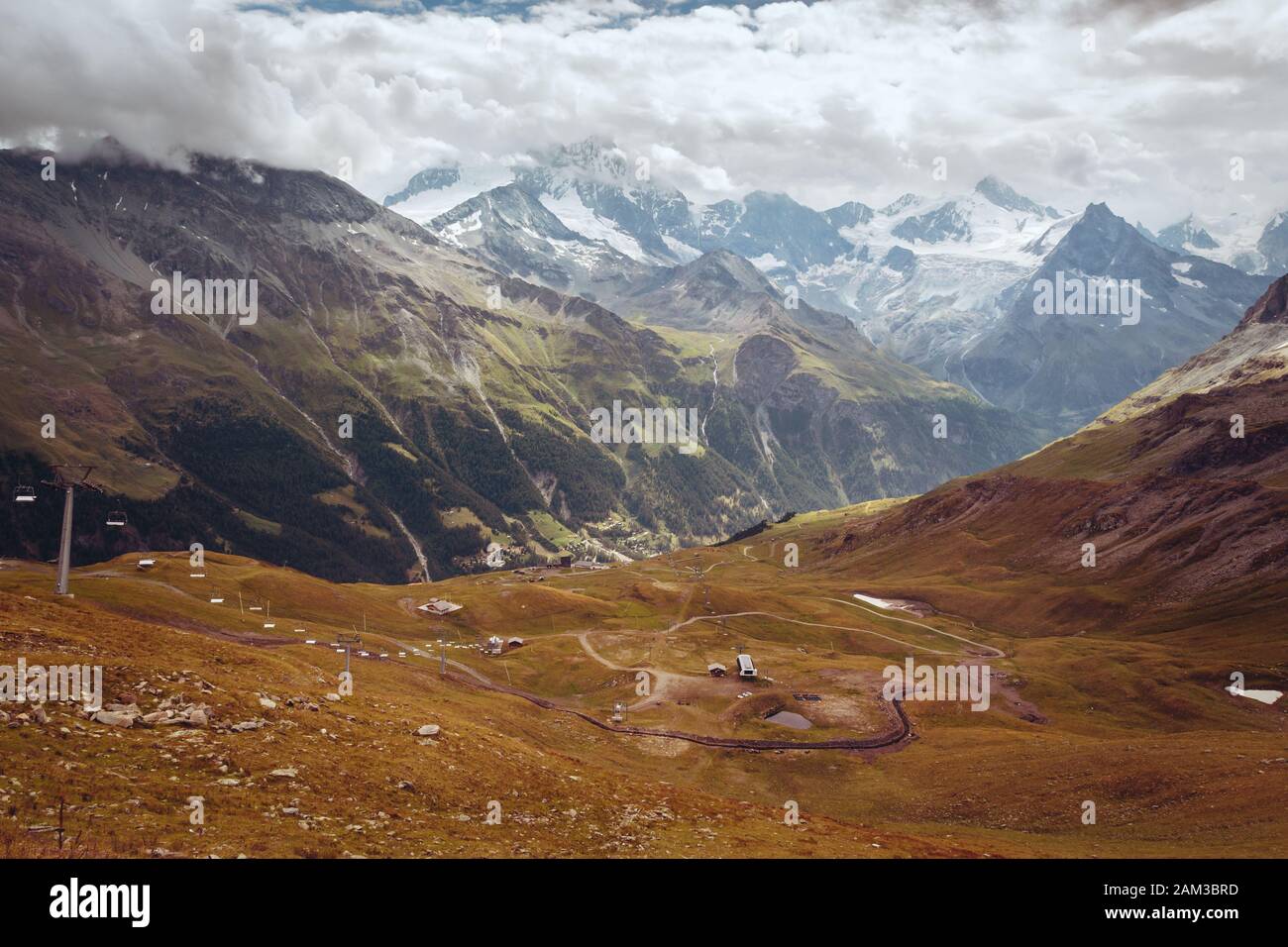 Spectacular mountain view on snow capped and glacial slopes of Weisshorn from Corne de Sorebois on a cloudy summer day. Zinal, Anniviers, Valais, Swit Stock Photo