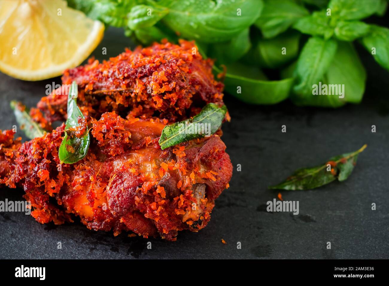 Authentic Indian Chicken fry with spices, curry leaf and coconut