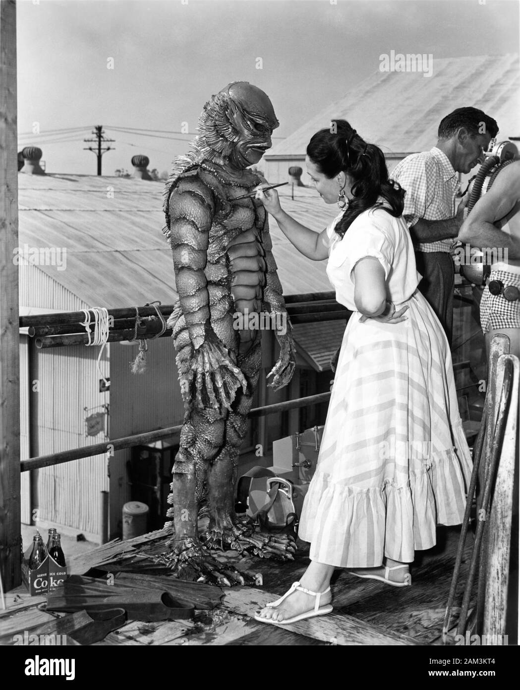THE GILL MAN on set location candid having touch up from make-up artist during filming of CREATURE FROM THE BLACK LAGOON 1954 director JACK ARNOLD filmed in 3D producer William Alland Universal International Pictures (UI) Stock Photo