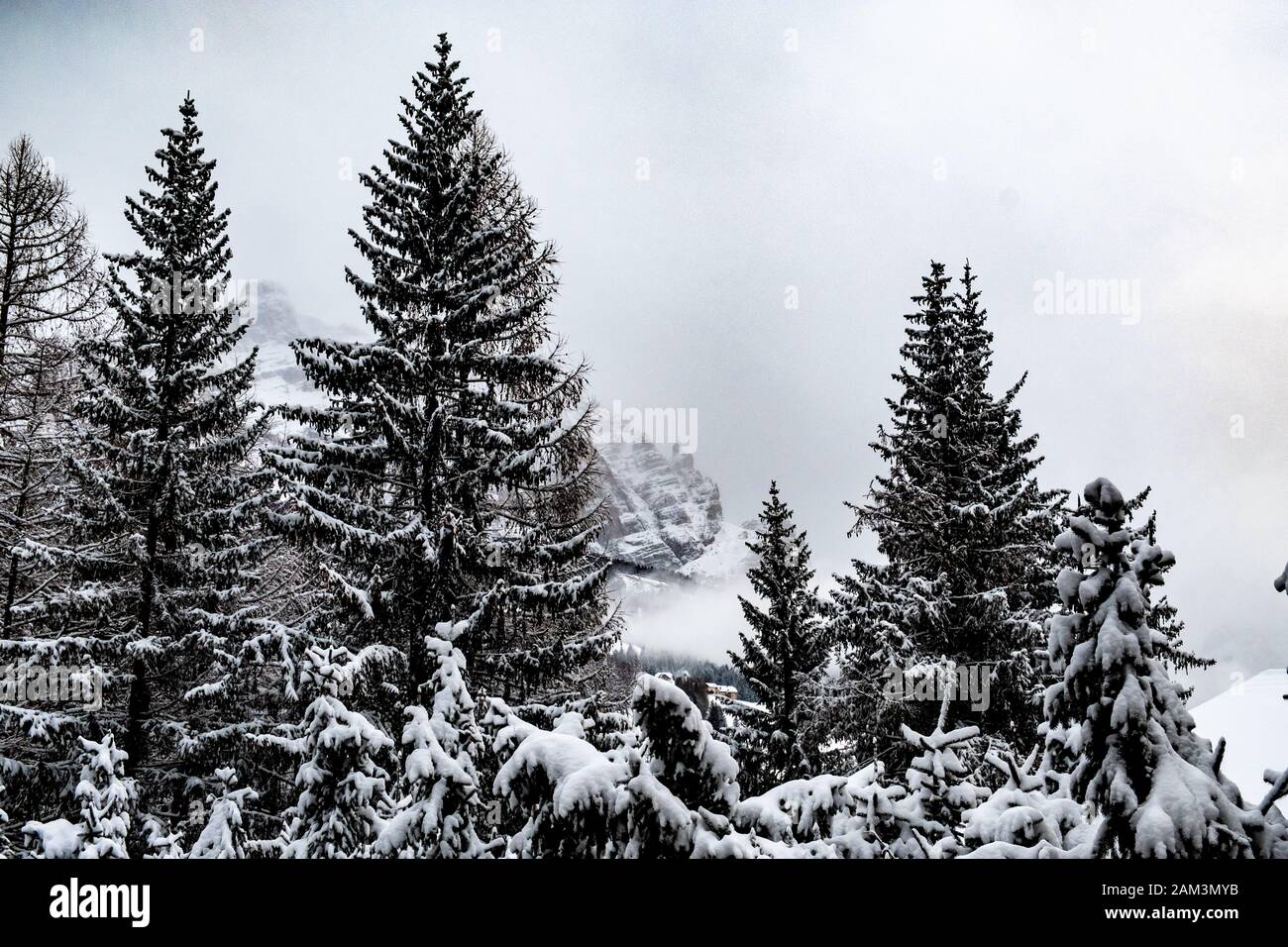 Clouds carrying snow in the italian alps Stock Photo - Alamy
