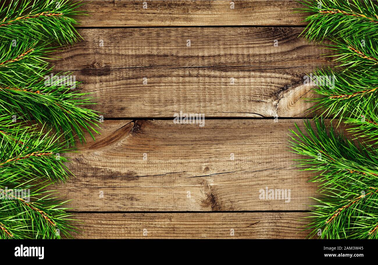 Wooden background with pine tree branche edges Stock Photo - Alamy