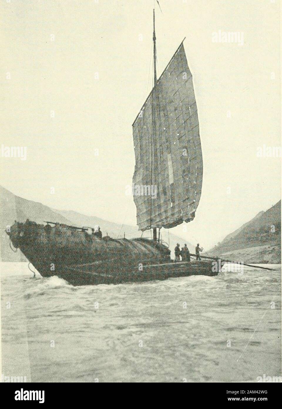 Travels in north and central China . LARGE JUNK WITH MAST DOWN. As we passed we saw a large junk careened forrepairs to her bottom, and a little further on, dryingon the beach, the cargo of another which had beenwrecked. Owing to our official escort we wereprivileged to go right to the head, had we chosento do so, but we took our place behind three otherboats which were waiting. We moored at thenarrowest point, where the stream was ascertainedby Matheson to be 175 yards wide, with a currentrunning at about 10 knots as far as one could tell,so that the channel would be difficult for a steamer.. Stock Photo