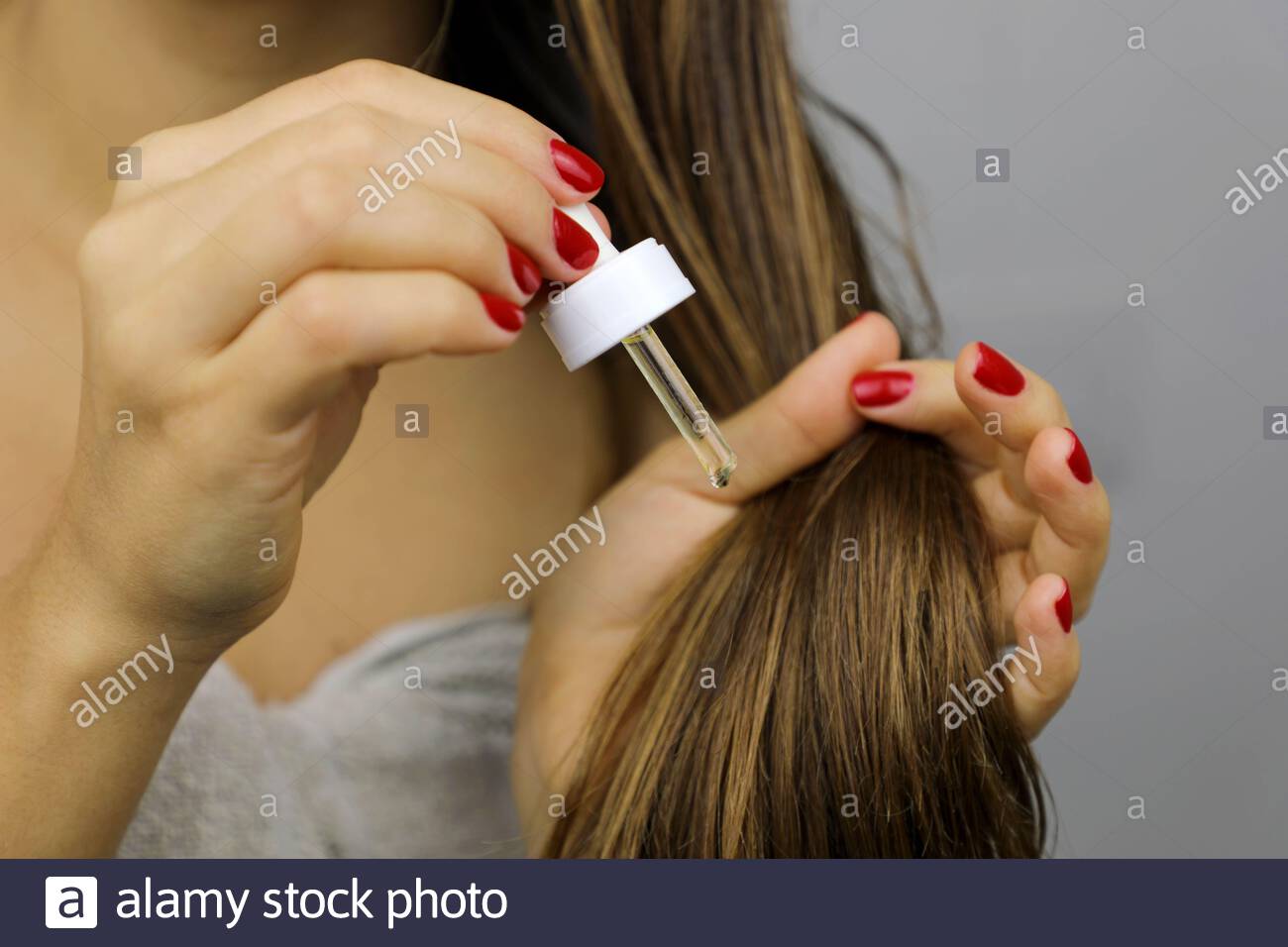 Woman Applying Oil On Dry Hair Or Sun Protection Concept Split
