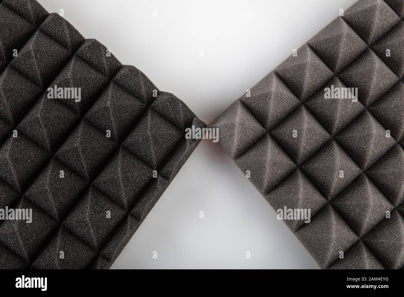 Sound proof Acoustic black gray foam absorbing, pyramid style padding layer  panel for voice recording studio attach on wall as wallpaper background to  Stock Photo - Alamy