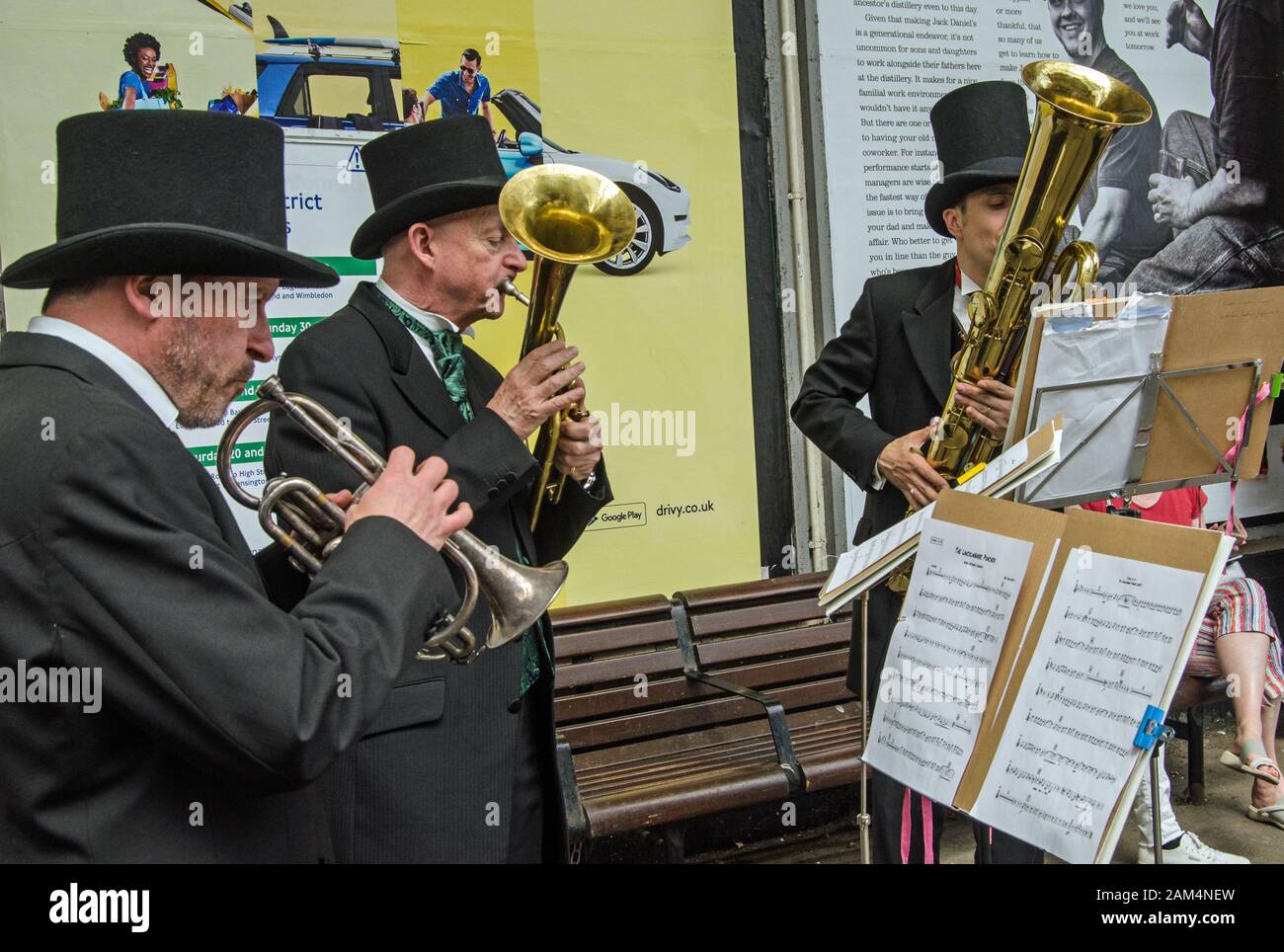 London, UK - June 22, 2019: Musicians playing historic Victorian brass instruments.  Members of the band Queen Victoria's Consort playing historic sax Stock Photo