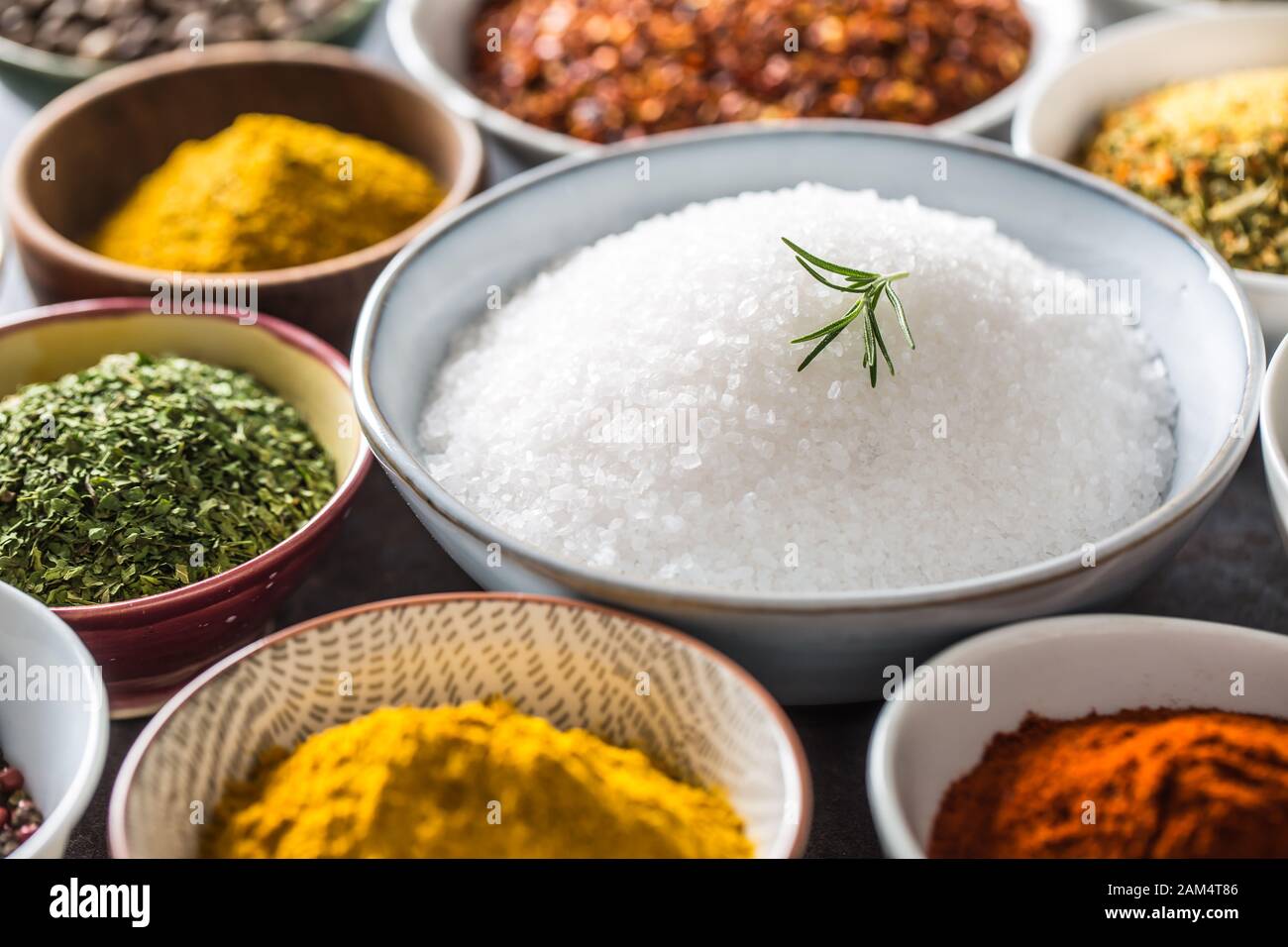 Salt and variety spices and herbs in bowls Stock Photo Alamy