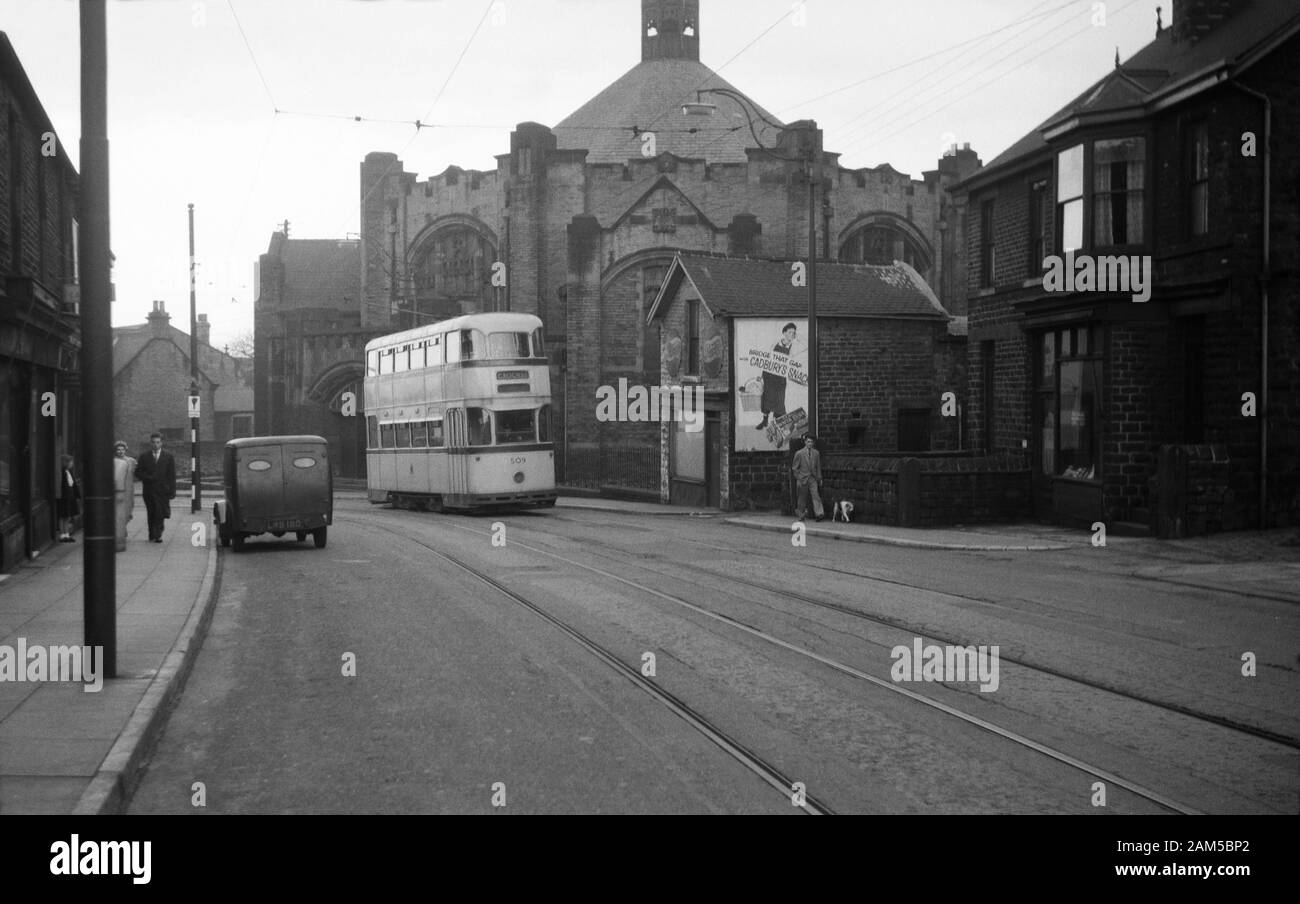 A Roberts manufactured Tram travels past the Wesley Hall, Methodist Church, Crookes, Sheffield S10 1UD. Image taken during the 1950s Stock Photo