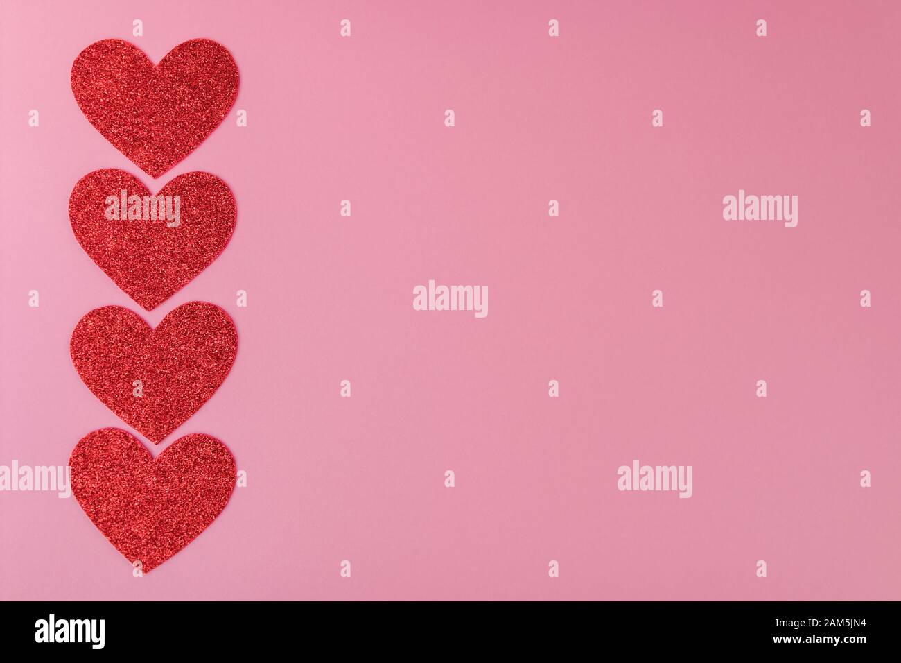 four red paper hearts arranged in a line on the background Stock Photo ...