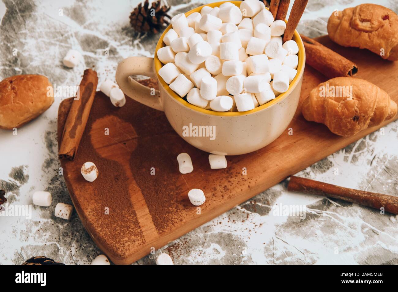 A Cup Of Christmas New Year Delicious Hot Chocolate And Cocoa With Marshmallows Sprinkled With Cocoa Powder Cones And Croissants Cinnamon On A Gray Stock Photo Alamy