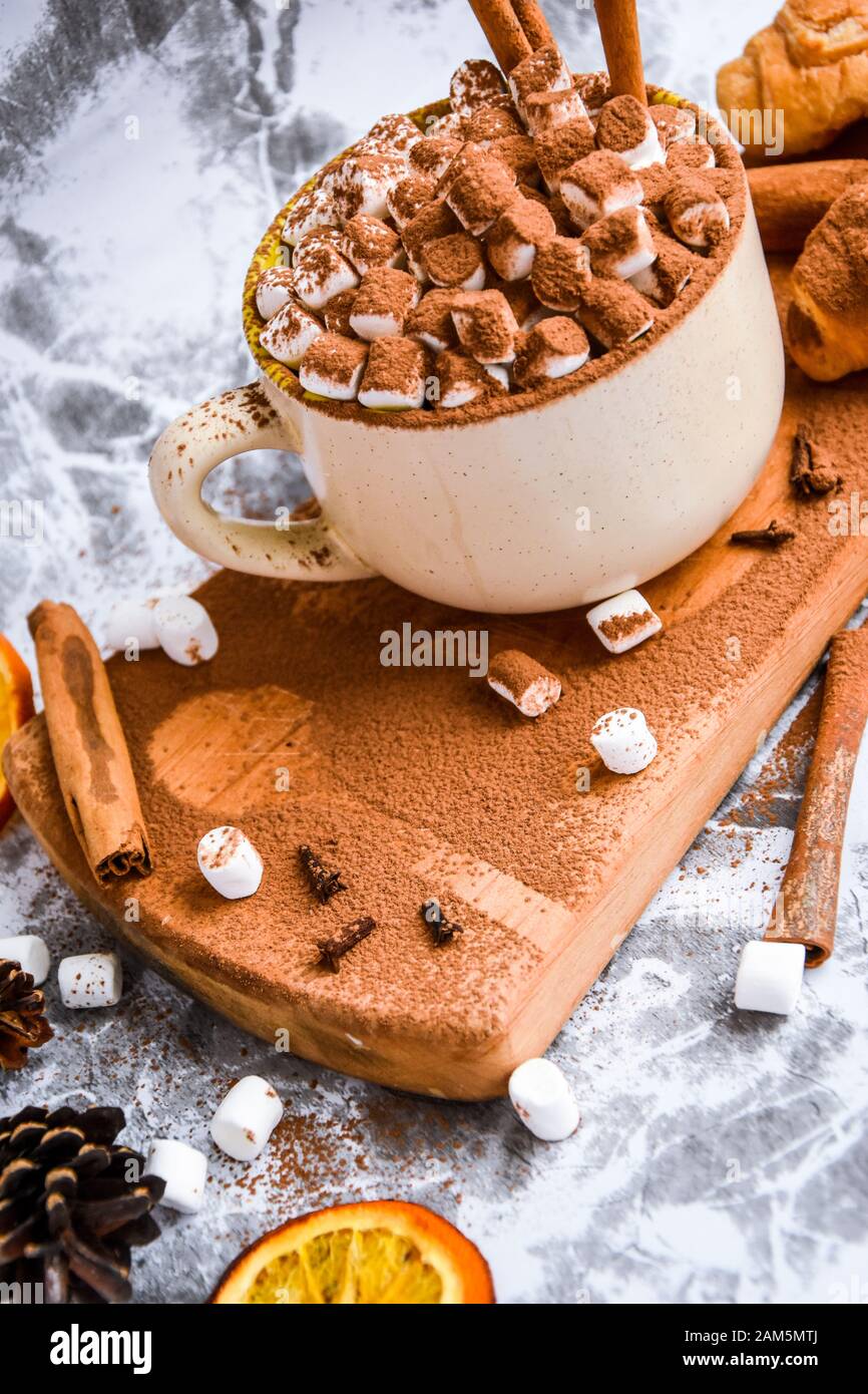 A Cup Of Christmas New Year Delicious Hot Chocolate And Cocoa With Marshmallows Sprinkled With Cocoa Powder Cones And Croissants Cinnamon On A Gray Stock Photo Alamy