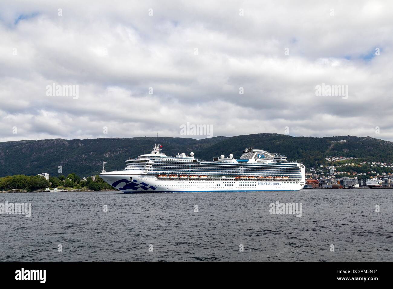 Cruise ship Sapphire Princess departing on a gray day from port of Bergen, Norway Stock Photo