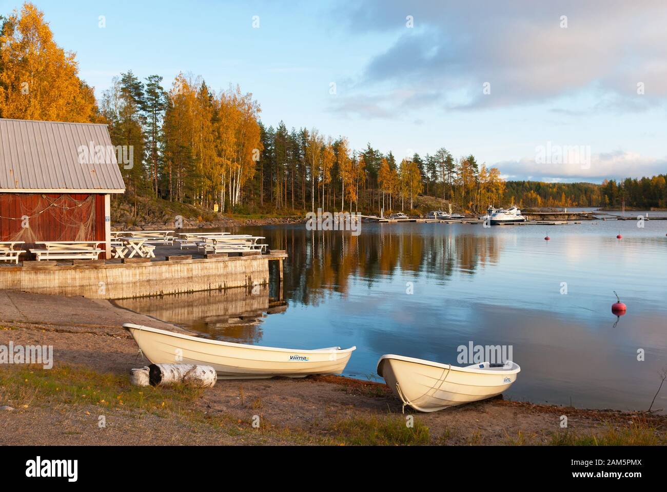 Puumala, Finland–October 5, 2019: Boats on the waterside of Saimaa Lake on the territory of Sahanlahti Resort. Puumala Municipality. Southern Savonia Stock Photo