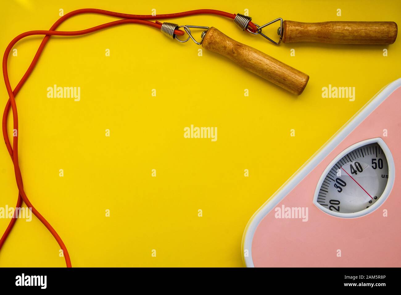 Modern weight scale with jumping rope stock photo Stock Photo Alamy