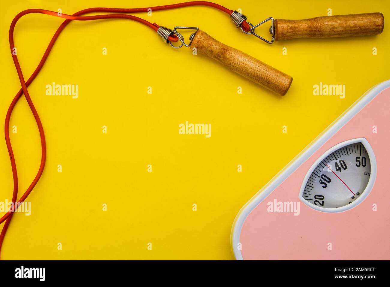 Modern weight scale with jumping rope stock photo Stock Photo Alamy