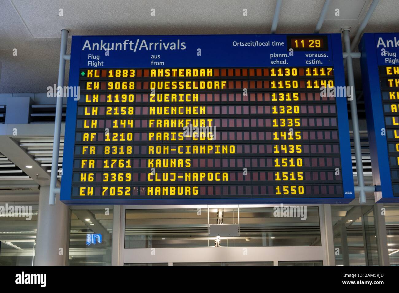 German Arrivals board at Nuremberg Airport Stock Photo
