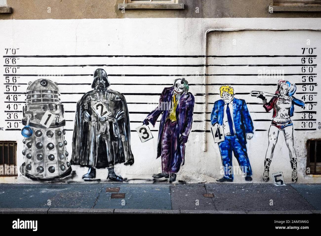 Wall art depicting Prime Minister Boris Johnson  appears in Worthing Town Centre on Thursday 29 August 2019 at Prospect Place , Worthing. The Wall Art which is just off of the seafront in the seaside town shows the Prime Minister in a police line up alongside a number of television and cinemas biggest villains  : A Dalek, Darth Vader, The Joker and Harley Quinn. Stock Photo