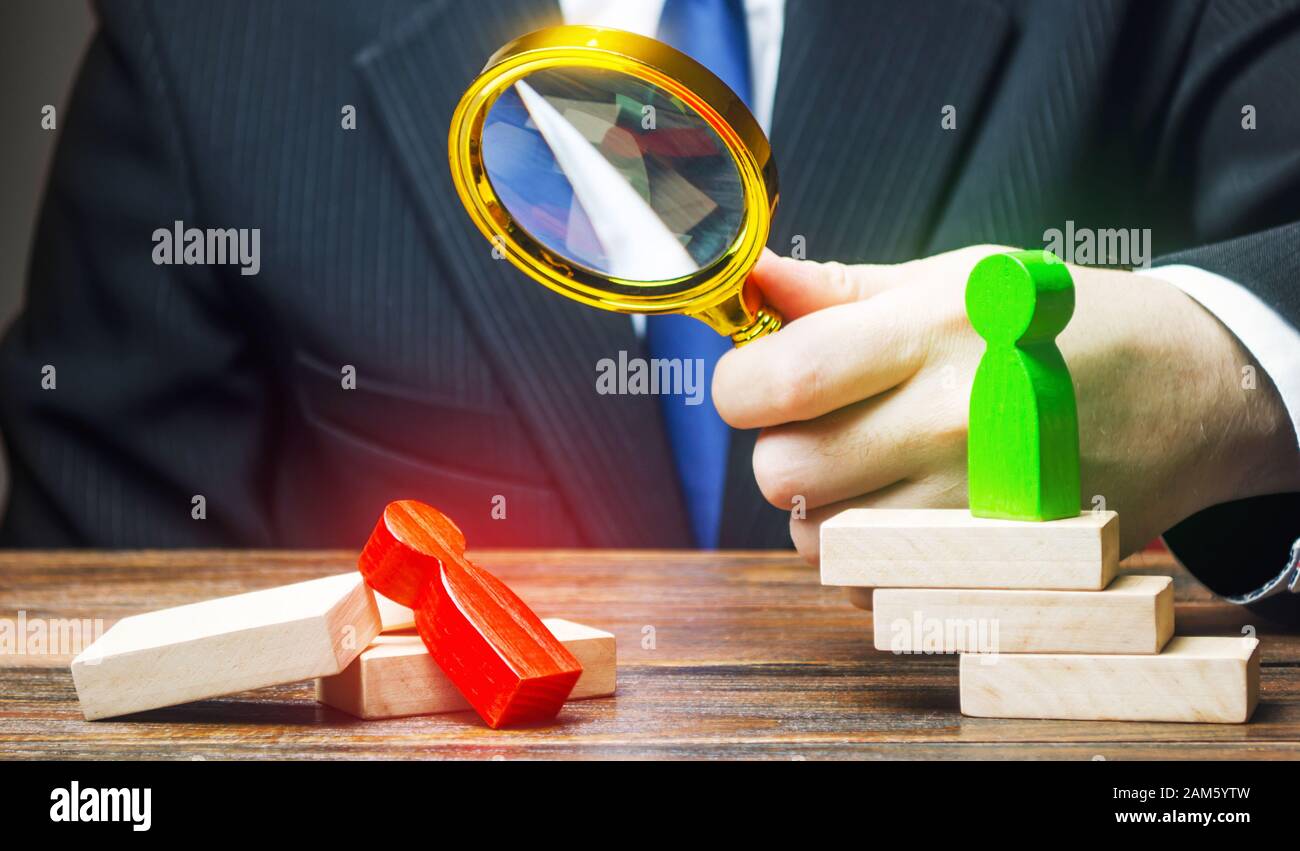 Man examines a defeated person. Analysis and work on mistakes. Weakness incompetence. Unprepared, unprofessional. Diplomacy, business. Competition, st Stock Photo