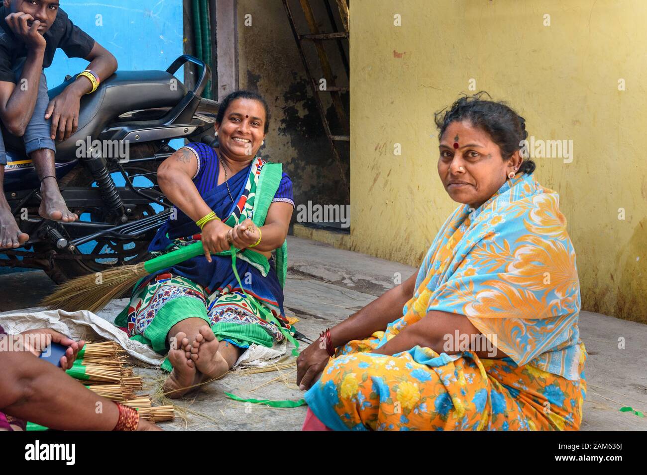 Indian women making brooms in Dharavi Slum at Mumbai. India Stock Photo