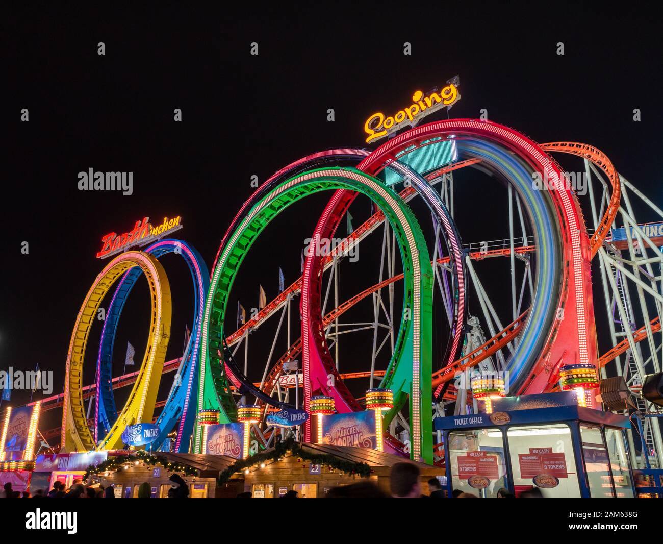 Big colourful rollercoaster, adrenalin entertainment in winter wonderland at night, in Christmas time, Hyde Park - London Stock Photo