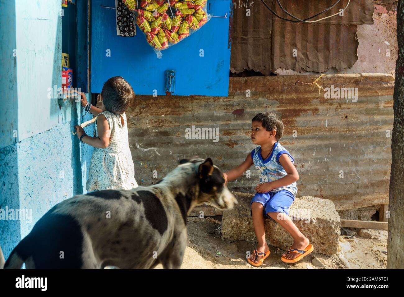 Indian children at the store near Suburban Railway in Dharavi Slum. Mumbai. India Stock Photo