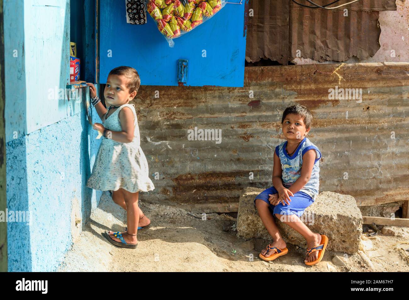 Indian children at the store near Suburban Railway in Dharavi Slum. Mumbai. India Stock Photo