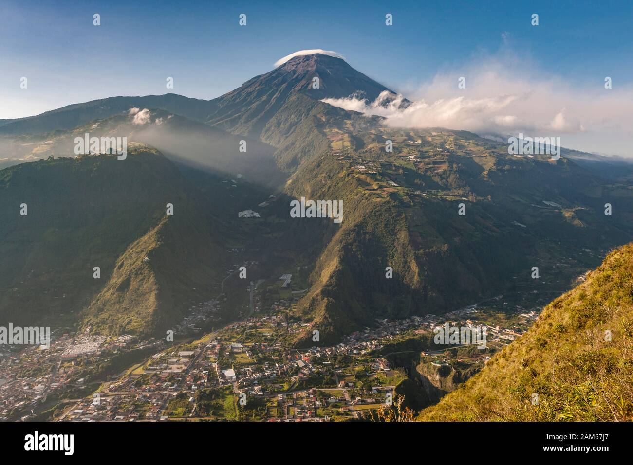 View of the town of Baños de Agua Santa and Tungurahua volcano (5023m) in Ecuador. Stock Photo
