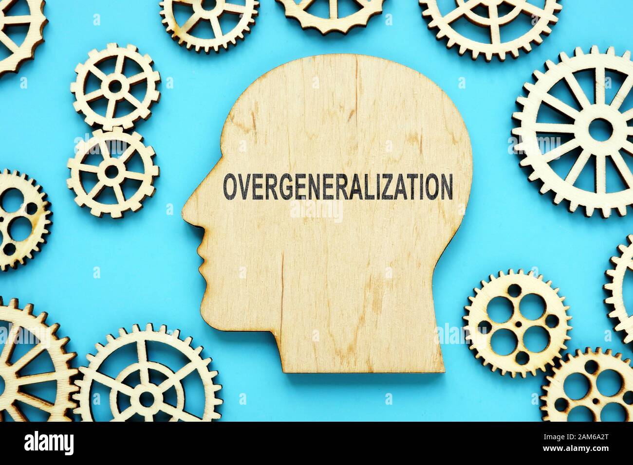 Overgeneralization word on the wooden head shape. Symptom of social anxiety concept. Stock Photo