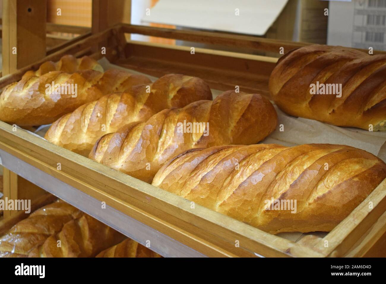 Loafs on a shelf in a bakery close-up. Department of baking bread ...