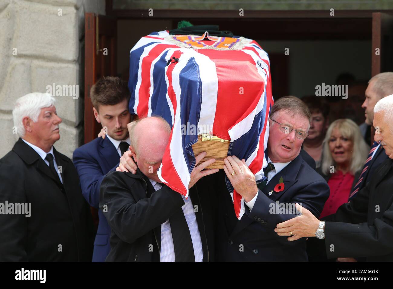 Joe Frazer (front right) helps carry the coffin of his brother Willie Frazer after the funeral service at Five Mile Hill Full Gospel Fellowship Church on the Maytown Road, County Armagh, Monday July 1st, 2019. Stock Photo