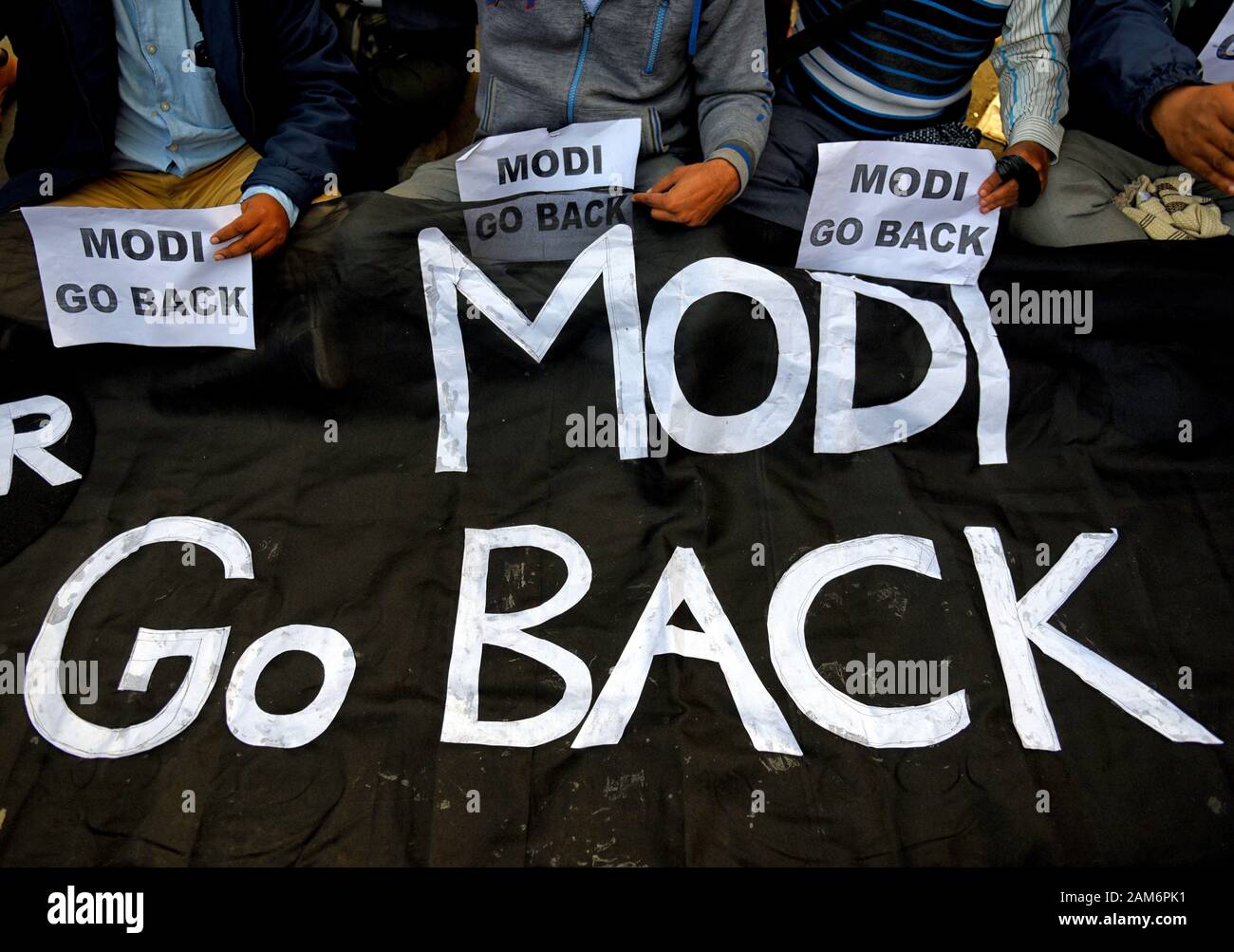 Kolkata, India. 11th Jan, 2019. Protesters hold placards during the demonstration.Demonstration against the visit of India's Prime Minister Narendra Modi and also against (Citizenship Amendment Bill) or CAB which grants Indian citizenship to non-Muslims of Afghanistan, Pakistan and Bangladesh that was passed by the Indian Government in December 2019 and has created violence, strike and protest all over the India. Credit: Avishek Das/SOPA Images/ZUMA Wire/Alamy Live News Stock Photo