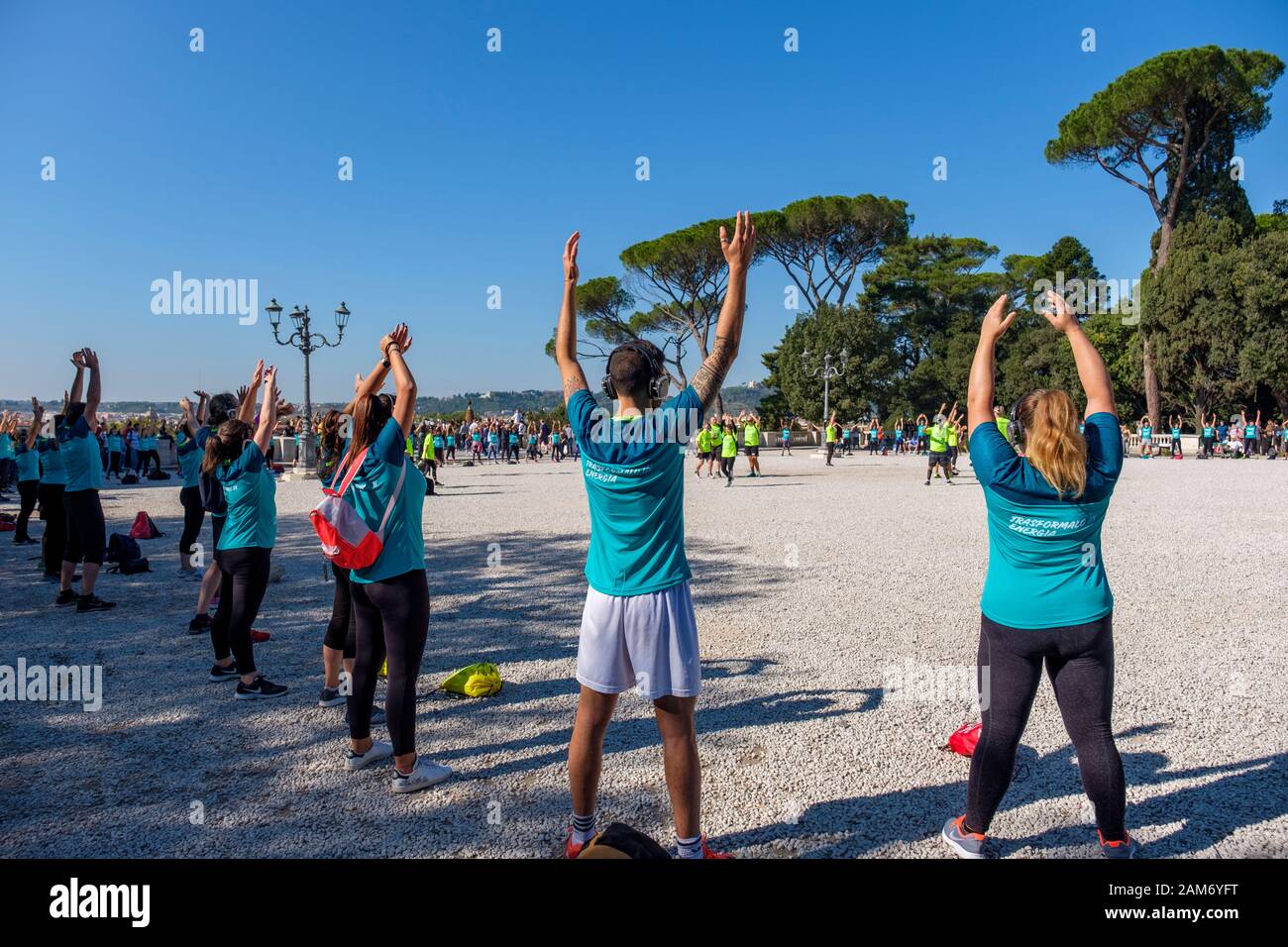Street Workout Green Genius, group of people exercising outdoors at Terraza del Pincio, Villa Borghese city park, Rome, Italy Stock Photo