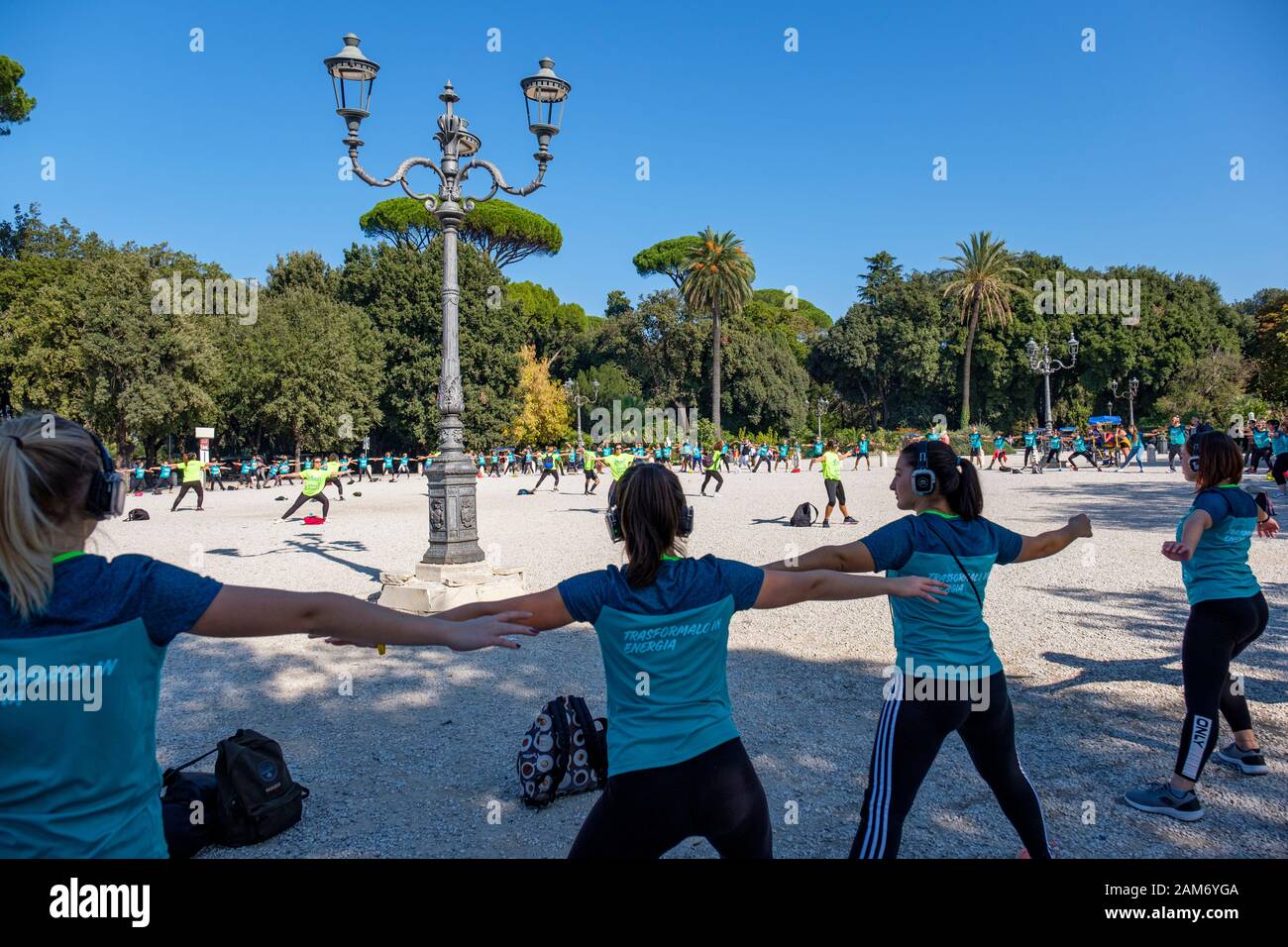 Street Workout Green Genius, group of people exercising outdoors at Terraza del Pincio, Villa Borghese city park, Rome, Italy Stock Photo