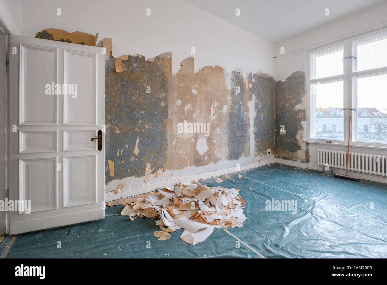 old room during renovation removing wallpaper Stock Photo Alamy