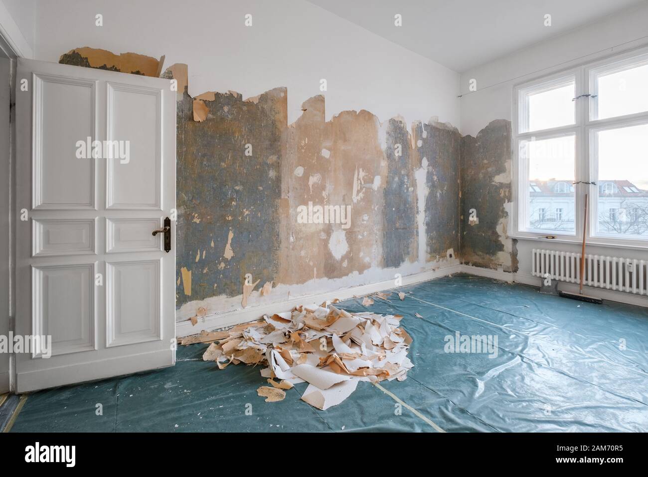 old room during renovation removing wallpaper Stock Photo