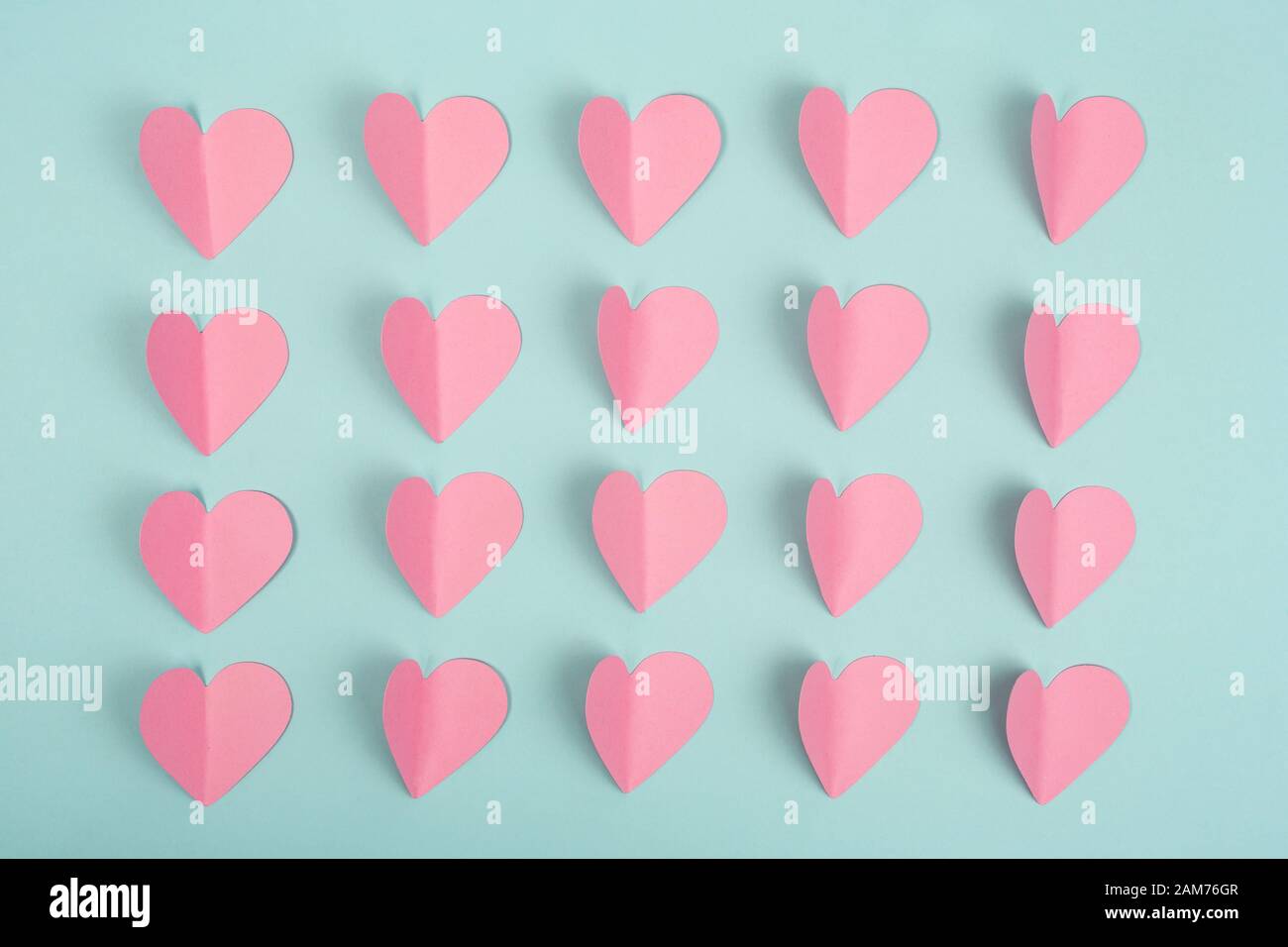 Rows pink hearts blue background hi-res stock photography and images - Alamy