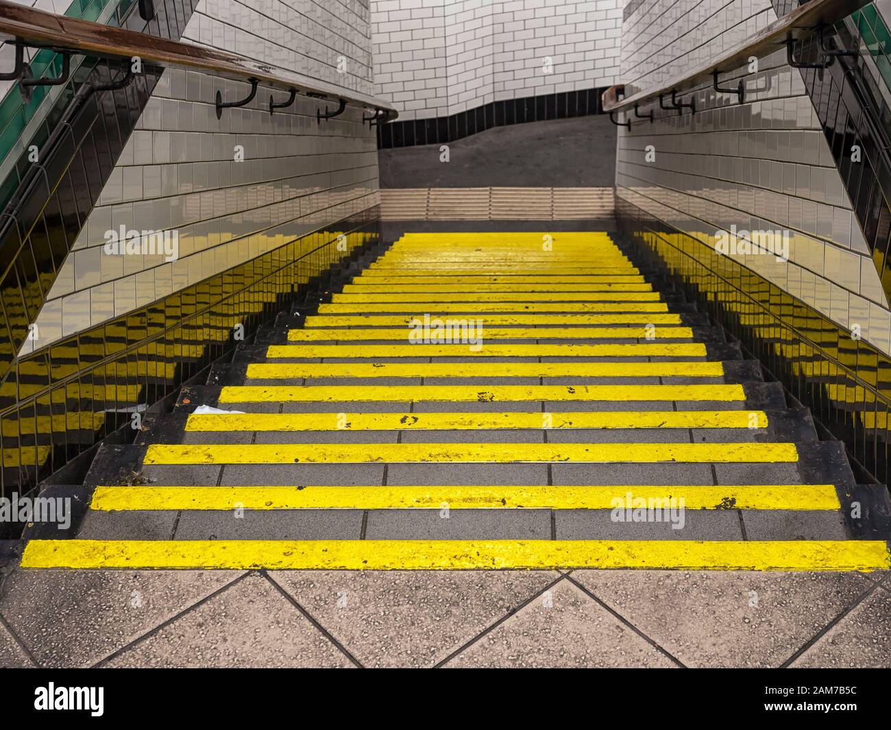 BACKGROUND View down public stairs with Yellow safety lines on steps