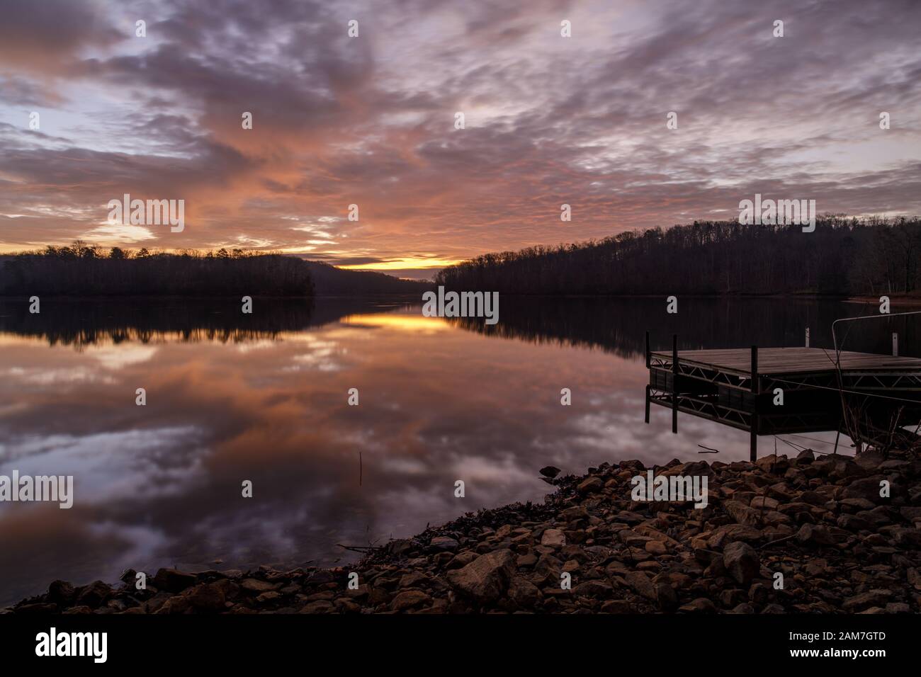 Sunrise Reflection - Lake Sidney Lanier. Beautiful December sunrise duplicated in the water's surface at Wahoo Creek Park. Sunrise Reflection - Lake S Stock Photo