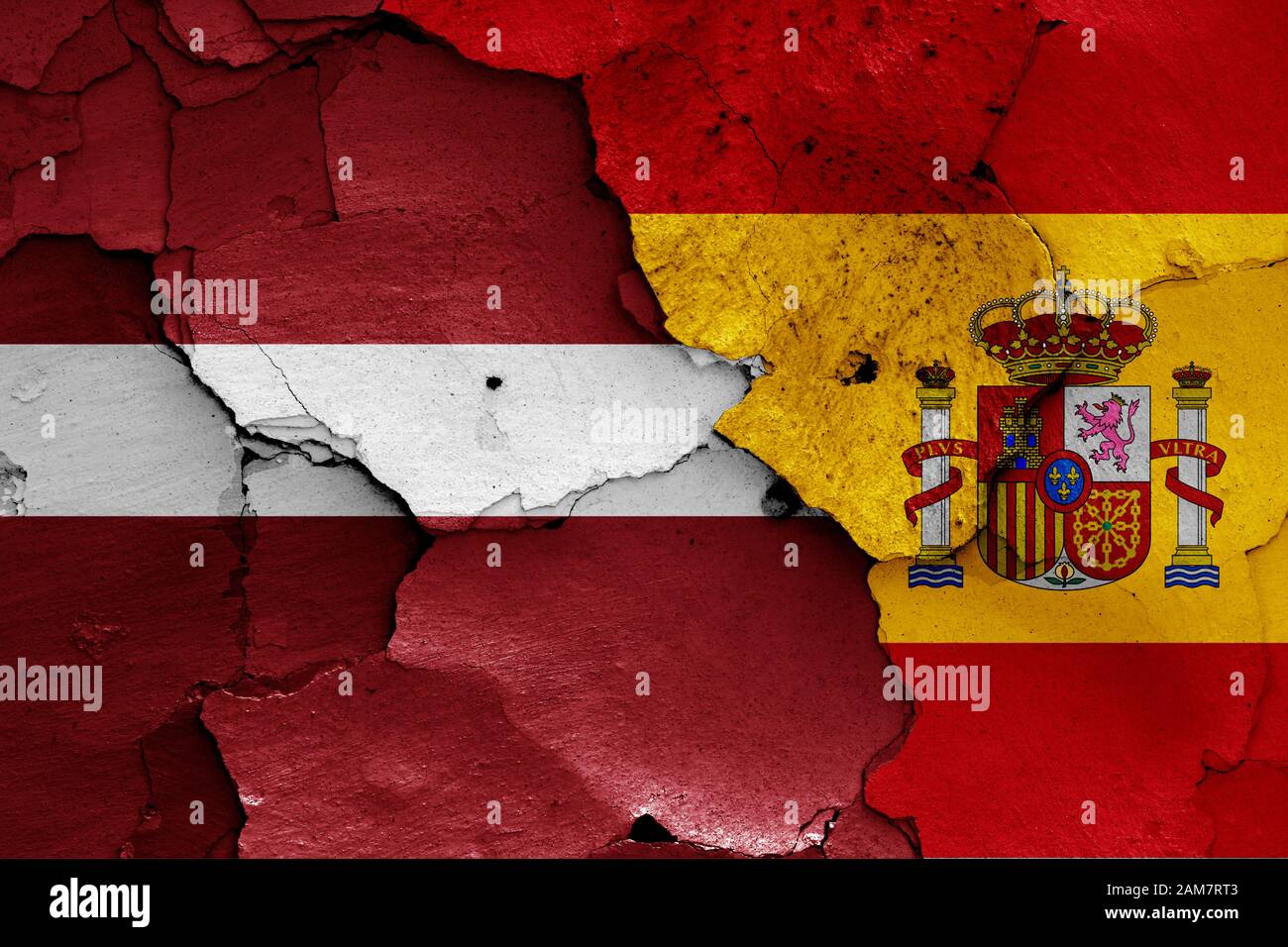 flags of Latvia and Spain painted on cracked wall Stock Photo - Alamy