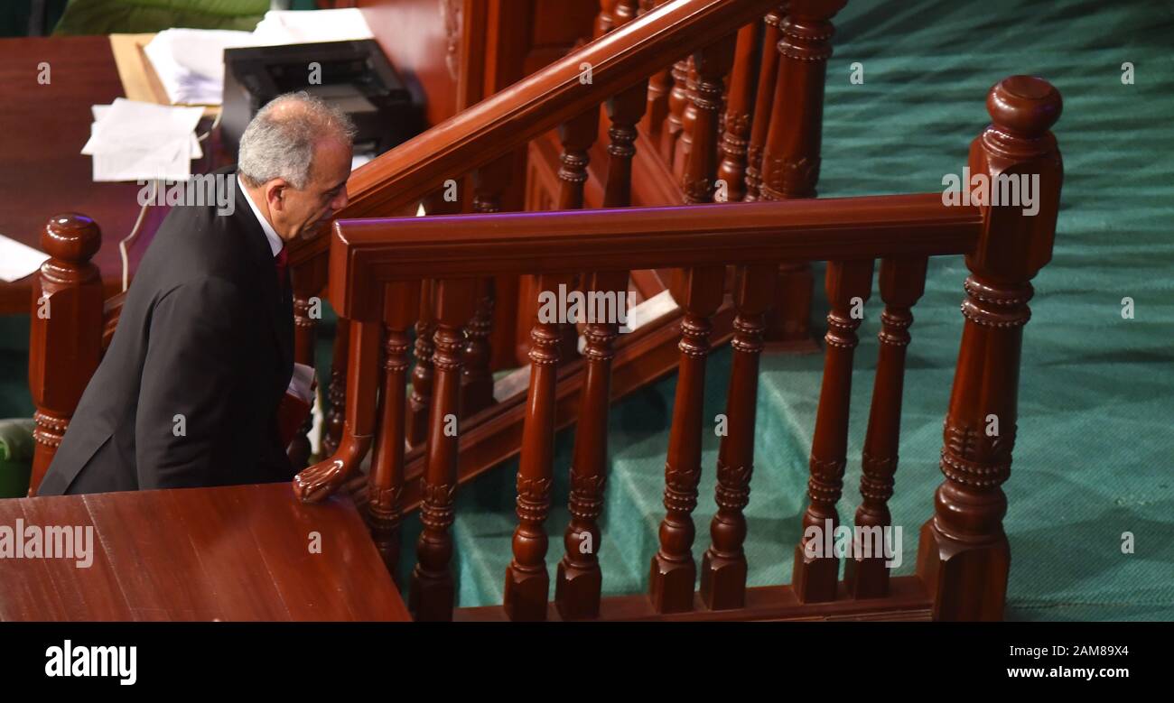 Tunisian parliament speaker Rachid al-Ghannouchi walks to the podium to where he announced that the government of Jemli fell after a no-confidence vote in parliament.The government managed with 72 votes with just 134 deputies against, Parliament Speaker Rachid Ghannouchi announced after the session that lasted more than 10 hours. Stock Photo