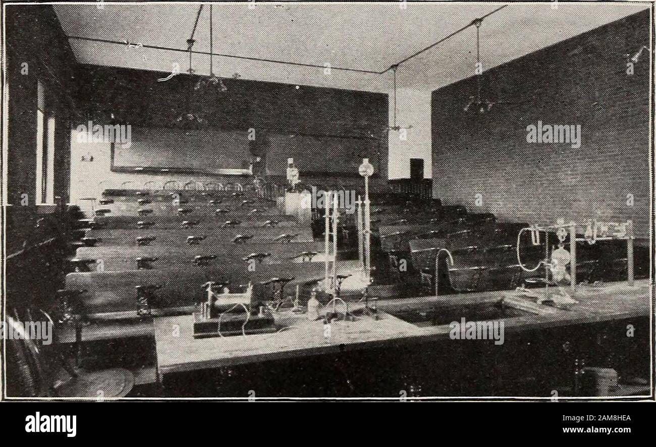 Catalogue of the New Hampshire College of Agriculture and the Mechanic Arts . Quantitative Chemical Laboratory.. Chemical Lecture Room. LABORATORIES AND EQUIPMENT. 20, connected to the universal alternator or to the secondary ofthe transformer on the lighting system ; a bank of lamps forillustrating the various methods of distributing from mains forlighting systems, or affording loads in obtaining characteris-tics, efficiencies, etc. ; and standard forms of voltmeters andammeters. For more strictly electrical engineering work, the depart-ment has the five-hundred-light alternator used in light Stock Photo